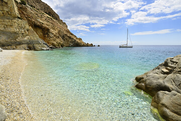 The famous white pebble beach called "Seichelles" on the south coast of the Greek island of Ikaria  in the North Aegean