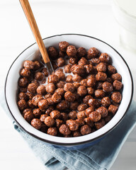 Round cocoa flakes in a bowl. Dry breakfast.