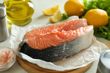 Fresh raw salmon and ingredients for cooking, close up