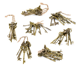 old brass key against a white background
