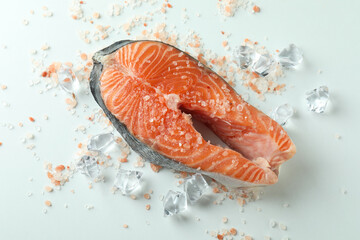 Fresh raw salmon and spices on white background