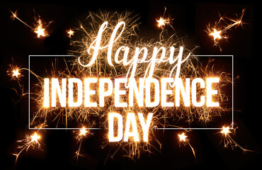 Happy Independence Day greeting in sparkler design on dark background.