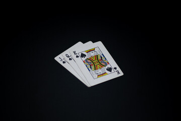 playing cards showing symbols King of Spades Queen of Spades Jack of Spades