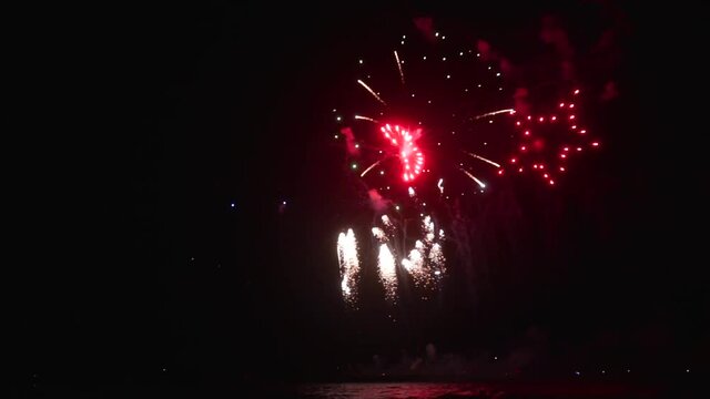 A beautiful shot of fireworks display against a dark sky background in HD