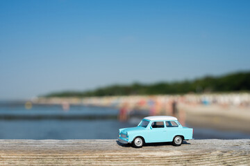 Baltic Sea - Germany - closeup of an old turquoise miniature car at the beach on a sunny day at the...