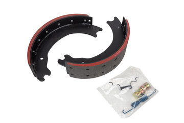 drilled brake pads with truck brake pads on an isolated white background. A set of two parts. With repair kit
