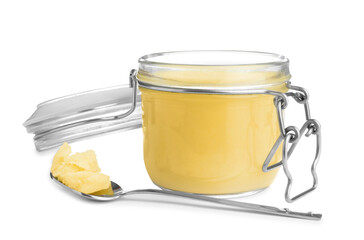 Glass jar and spoon of Ghee butter isolated on white
