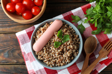 Concept of tasty eating with buckwheat on wooden table