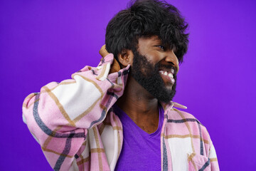 Portrait of smiling young black man in studio