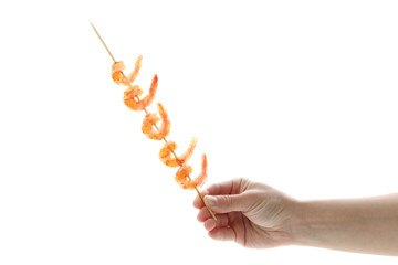 Female hand holds grilled shrimps skewer, isolated on white background
