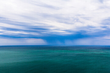 Fototapeta na wymiar Rain in the sea. The water cycle. Sea and rain.