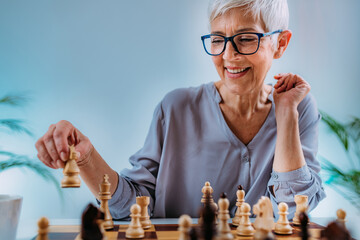 Cognitive Rehabilitation Activity. Senior Woman Playing Chess.