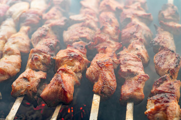Skewers of pork. Fried pork meat cooked over burning coals.