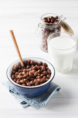 Round cocoa flakes in a bowl. Dry breakfast.