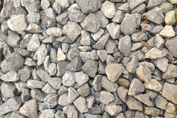 Gravel road stone pattern. Small rock or pebble textured. Top view. Gravel surface