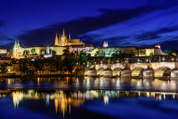 The famous Prague castle with the Charles bridge during a blue hour.