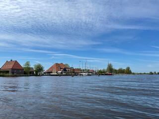 Fototapeta na wymiar Sailing school at lake around Heeg in Friesland