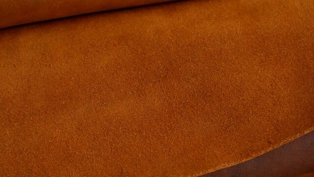 brown leather background. matte and shiny skin surface in brown tones.genuine leather surface.brown genuine leather assortment