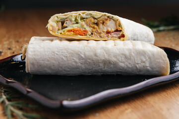 Delicious Juicy shawarma on a black background