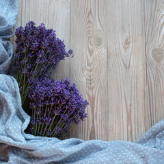 Fresh lavender on a white wooden background with a blue scarf