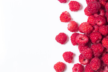 A bunch of ripe raspberries on a white background. Raspberry with copy space for text. Delicious berry