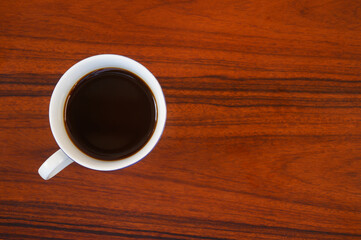 cup of coffee on wooden table