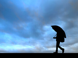 傘をさして歩く子供_悪天候