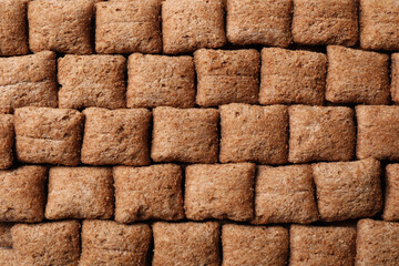 Crispy corn pads as background, top view