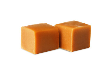 Two sweet caramel candies on white background