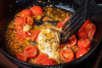 Chef cooking food for italian cuisine, tomato sauce for pasta, mediterranean diet concpet, detailed view of hands and pan with fried tomatoes