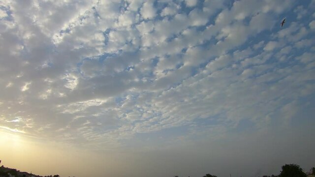 4K Time lapse of the  clouds in the sky during the sunset