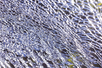 Cracks in the windshield of a car that has an accident while driving on the road.