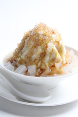 chilled soya pudding jelly with sea coconut sago ice snow kacang and brown sugar syrup in white bowl sweet dessert menu