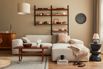 Modern interior of living room with design modular beige sofa, coffee table,  furniture, pendant...