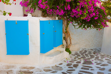 Traditional colorful view in narrow alley in Mykonos island cyclades Greece