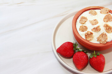 white milk yogurt in a decorative plate