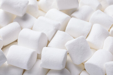 Delicious white puffy marshmallows as background, closeup