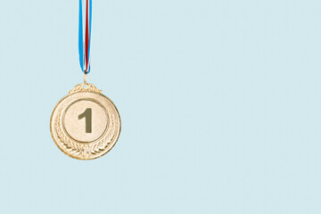 gold medal on blue background.award and victory concept.copy space