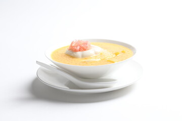 chilled mango sago fruit with pomelo and soya pudding jelly in white bowl sweet dessert menu