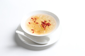 chilled double boiled fresh bird nest with hashima and wolf berries asian sweet soup in white bowl healthy dessert menu