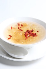 chilled double boiled fresh bird nest with hashima and wolf berries asian sweet soup in white bowl healthy dessert menu