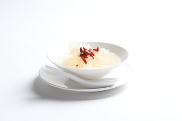 chilled double boiled fresh bird nest with hashima and wolf berries asian sweet soup in white bowl healthy dessert menu