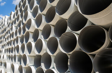 Downpipe warehouse. Steel pipes, parts for the construction of a roof drainage system in a...