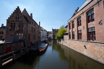 27 April 2021, Bruges, Belgium, walking on medieval Bruges streets in sunny day, travel destination