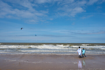 North sea waves and sandy beach in sunny day