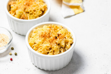 Creamy rich cheesy crust macaroni and cheese in backing dish.Space for text.