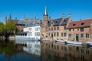27 April 2021, Bruges, Belgium, walking on medieval Bruges streets in sunny day, travel destination