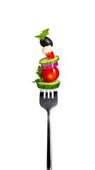 single metal fork with salad and various ingredients isolated on a white background