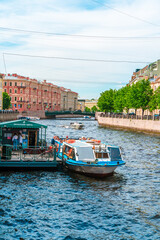 Panorama of the city of St. Petersburg in summer. Tourist boat tours on the river. Saint Petersburg, Russia - 05 June 2021
