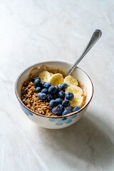 Granola with Blueberries, Banana and Peanut Butter Yogurt or Yoghurt.